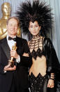 <b>Cher, 1986</b><br>Cher certainly set the bar for preposterous in Bob Mackie. The showgirl flamboyance, though, was an in-your-face gesture to the academy after she was <a href="http://www.popeater.com/2010/11/22/video-cher-and-christina-aguilera-interview-each-other/" rel="nofollow noopener" target="_blank" data-ylk="slk:egregiously snubbed;elm:context_link;itc:0;sec:content-canvas" class="link ">egregiously snubbed</a> for her performance in "Mask." She had been told, "the academy doesn't think you're serious, [when] you don't dress seriously," so what other recourse did the singer-actress have except to supersize burlesque?