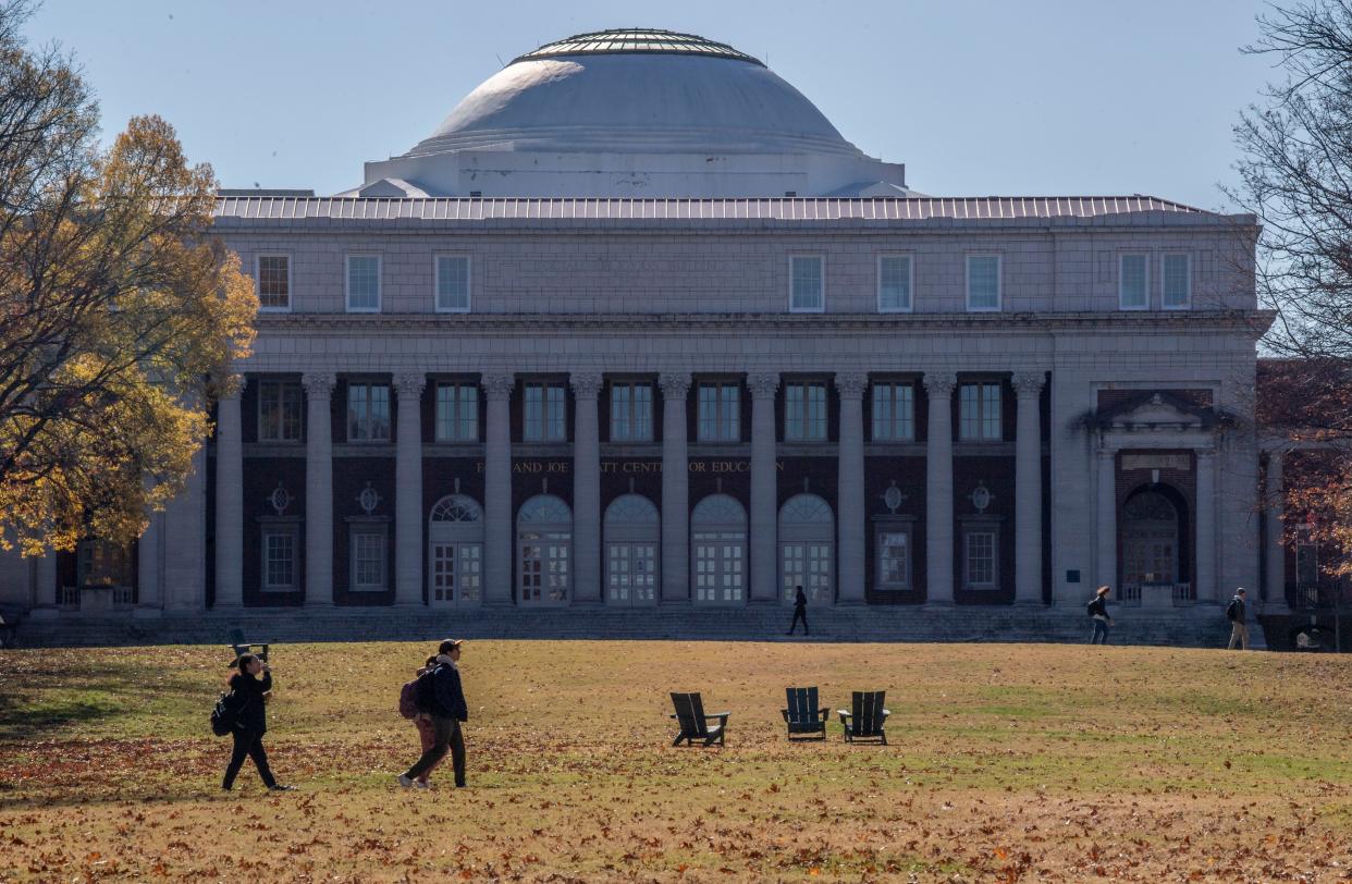 Students walk past the Faye and Joe Wyatt Center at Vanderbilt University in Nashville, Tenn., Monday, Nov. 27, 2023.