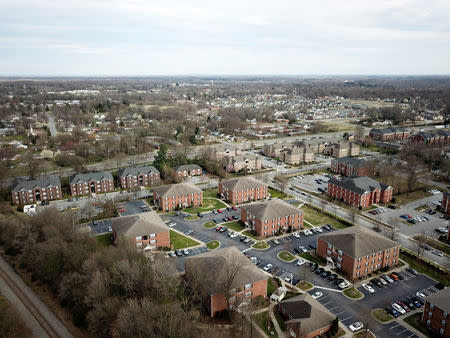 An aerial view looking southeast from a railroad track that briefly forms the boundary line between Congressional Districts 6 and 13, keeping the student housing complex to the south of the tracks in District 13 rather than District 6, Greensboro, North Carolina, U.S. March 13, 2019. Picture taken March 13, 2019. REUTERS/Charles Mostoller