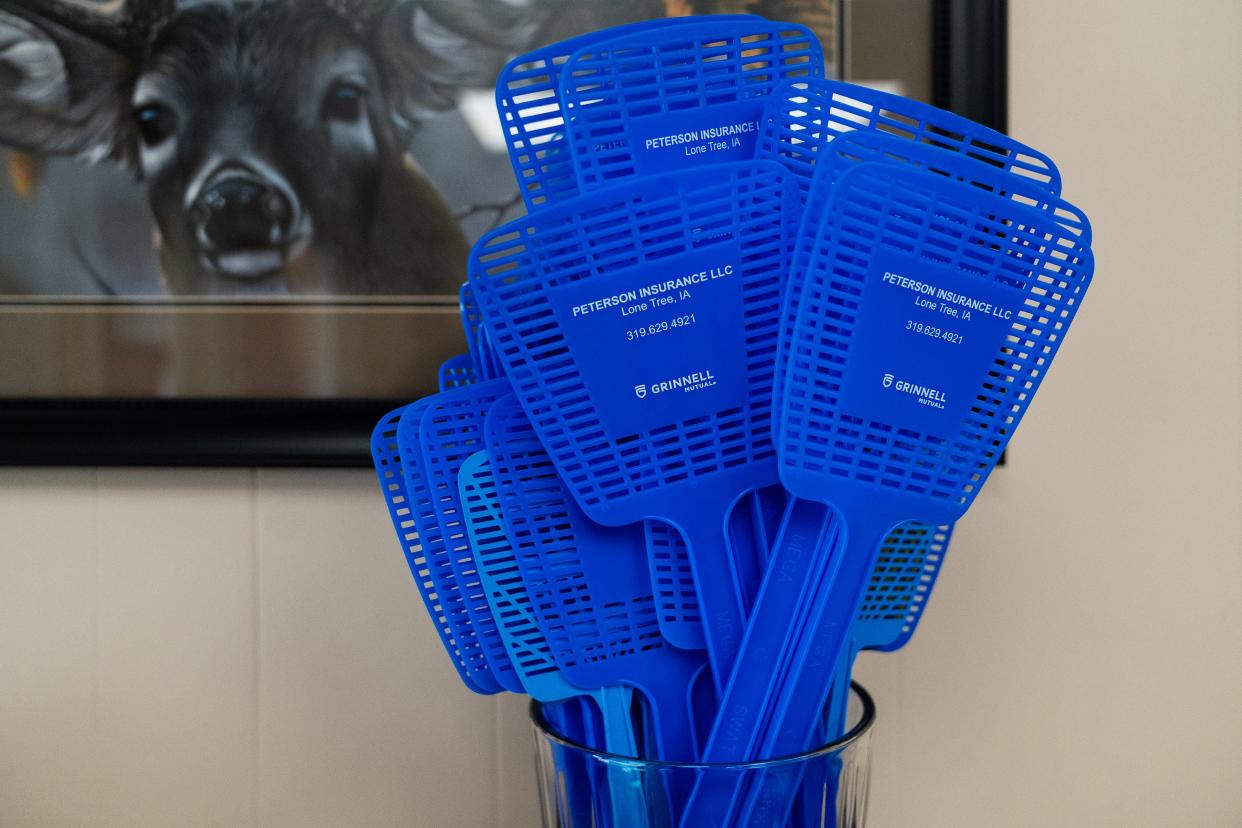 Fly swatters sit out in Phyllis Peterson's Peterson Insurance office, on Friday, Aug. 4, 2023, in Lone Tree.