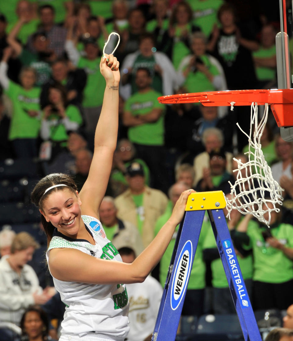 Notre Dame forward Natalie Achonwa holds a piece of the net after their NCAA women's college basketball tournament regional final game at the Purcell Pavilion in South Bend, Ind Monday March 31, 2014. Notre Dame beat Baylor, 88-69. (AP Photo/Joe Raymond)