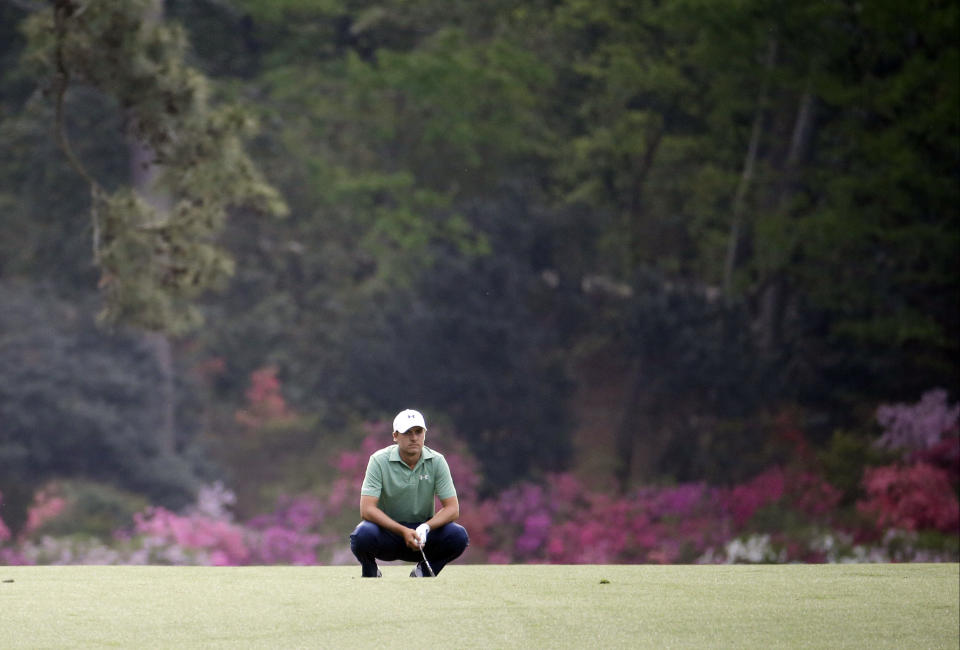 Jordan Spieth reacts to his shot off the 14th fairway during the fourth round of the Masters golf tournament Sunday, April 13, 2014, in Augusta, Ga. (AP Photo/Darron Cummings)