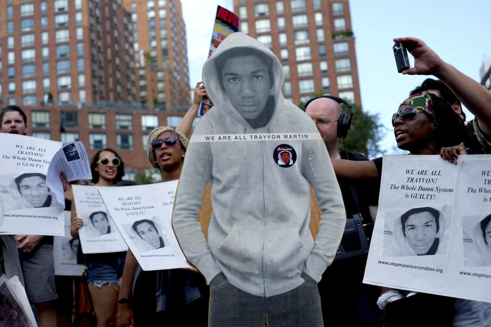 FILE - Activists in New York's Union Square stand with a cutout photo of Trayvon Martin, July 14, 2013, during a protest in response to the acquittal of volunteer neighborhood watch member George Zimmerman in the 2012 killing of Martin in Sanford, Fla. The Black Lives Matter movement hits a milestone on Thursday, July 13, 2023, marking 10 years since its 2013 founding in response to Zimmerman's acquittal. (AP Photo/Craig Ruttle, File)