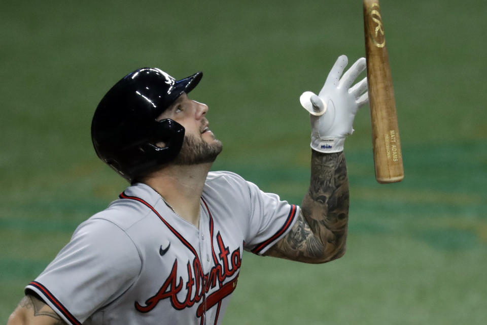 Atlanta Braves' Matt Adams flips his bat as he pops the ball up against the Tampa Bay Rays during the seventh inning of a baseball game Monday, July 27, 2020, in St. Petersburg, Fla. The ball dropped foul. (AP Photo/Chris O'Meara)