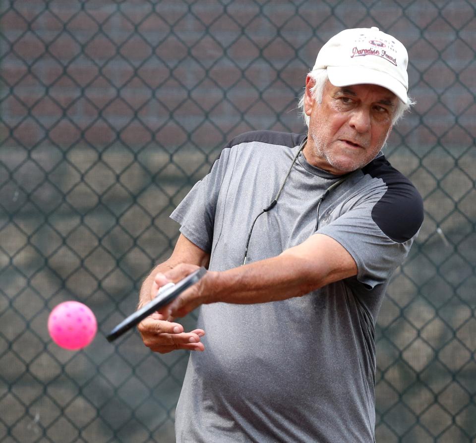 Harry "Hop" Delp plays pickleball against his friend Jennie Parrish at Stadium Park in Canton on Friday, July 1, 2022.