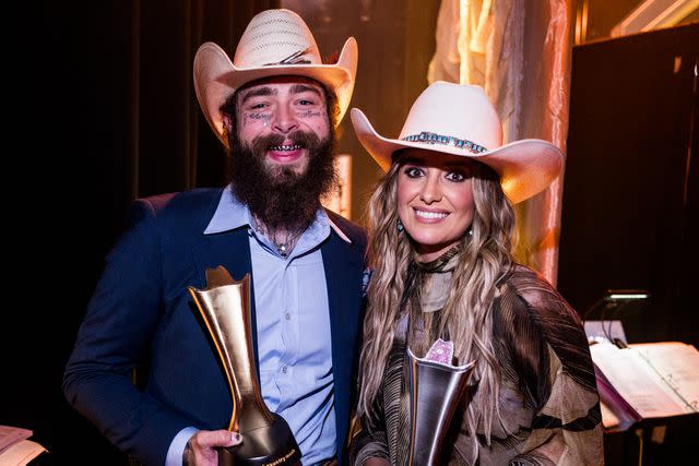 <p>John Shearer/Getty</p> Post Malone and Lainey Wilson at the ACM Honors in Nashville on Aug. 21, 2024