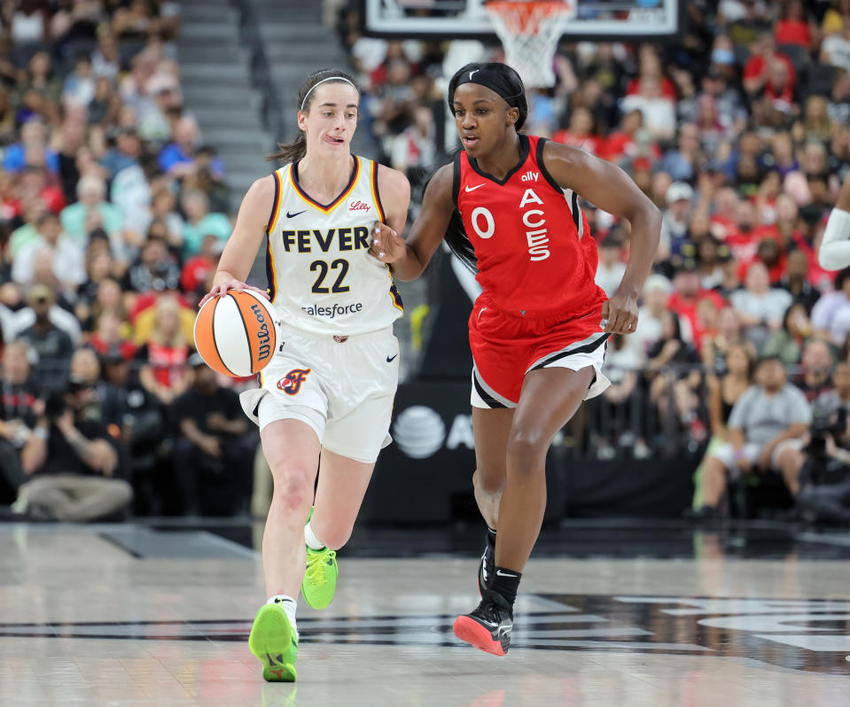 LAS VEGAS, NEVADA - JULY 2: Caitlin Clark #22 of the Indiana Fever brings the ball up the court against Jackie Young #0 of the Las Vegas Aces during the second quarter of their game at T-Mobile Arena on July 2, 2024 in Las Vegas, Nevada. The Aces defeated the Fever 88-69. NOTE TO USER: User expressly acknowledges and agrees that by downloading and/or using this photo, User agrees to the terms and conditions of the Getty Images License Agreement. (Photo by Ethan Miller/Getty Images)