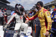Marco Andretti is congratulated James Hinchcliffe, of Canada, and Ryan Hunter-Reay after Andretti won the pole for the Indianapolis 500 auto race at Indianapolis Motor Speedway, Sunday, Aug. 16, 2020, in Indianapolis. (AP Photo/Darron Cummings)