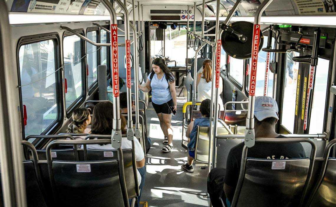 Riders board a Fresno FAX bus after stopping at Fresno City College on Tuesday, Aug. 15, 2023.