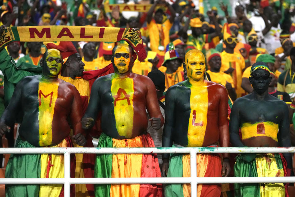 Mali fans wait for the start of the African Cup of Nations Group E soccer match between Tunisia and Mali at the Amadou Gon Coulibaly Stadium in Korhogo, Ivory Coast, Saturday, Jan. 20, 2024. (AP Photo/Sunday Alamba)