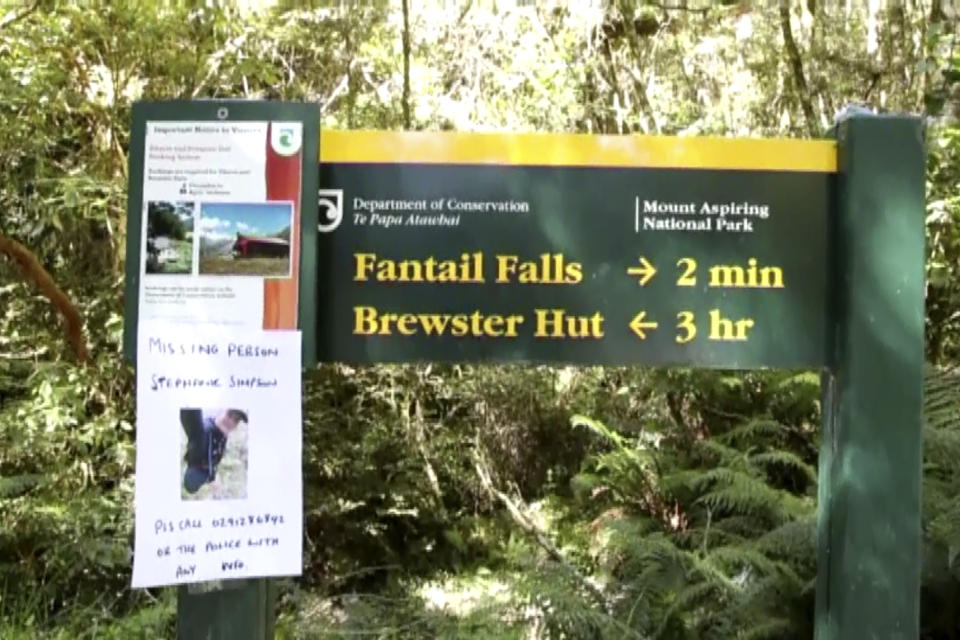 This Tuesday, Feb. 11, 2020, image made from video shows posters including a photo of British hiker Stephanie Simpson, left bottom, at Mount Aspiring National Park, New Zealand. Searchers found the body of Simpson on Friday, Feb. 14, 2020, almost a week after she went hiking in the national park. (Newshub via AP)