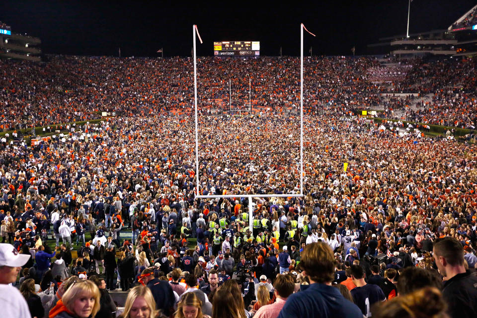 <p>Fans rush the field after Auburn defeated Alabama in the Iron Bowl NCAA college football game, Saturday, Nov. 25, 2017, in Auburn, Ala. (AP Photo/Brynn Anderson) </p>