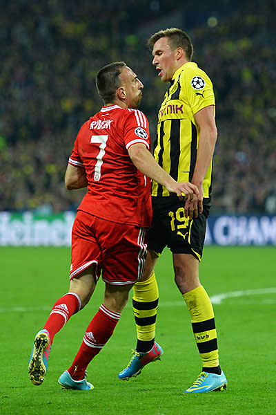 Franck Ribery of Bayern Muenchen remonstrates with Kevin Groskreutz of Borussia Dortmund during the UEFA Champions League final match between Borussia Dortmund and FC Bayern Muenchen at Wembley Stadium.