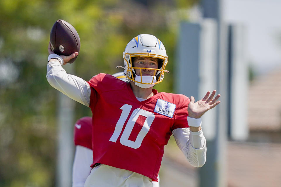 Los Angeles Chargers quarterback Justin Herbert throws during a joint NFL football practice with the New Orleans Saints, Thursday, Aug. 17, 2023, in Costa Mesa, Calif. (AP Photo/Ryan Sun)