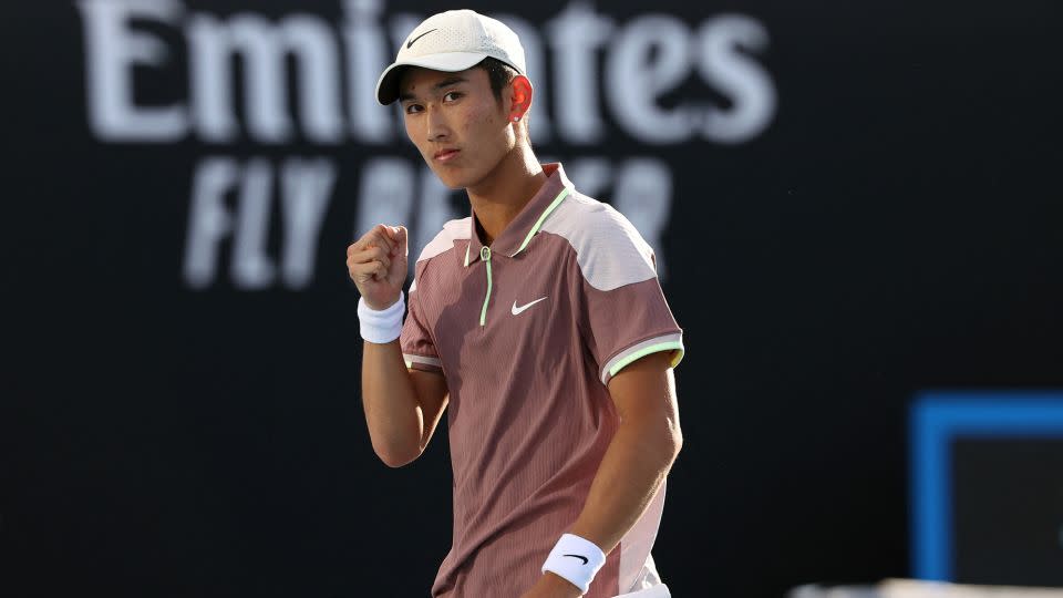 Shang celebrates during his Australian Open win against Mackenzie McDonald. - David Gray/AFP/Getty Images