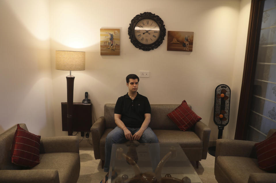 Karan Murgai, an IT management consultant for a multinational based in Dallas, sits in his Delhi house, in New Delhi, India, Tuesday, June 30, 2020. Murgai came to Delhi in March this year after his father died. Murgai and at least 1,000 others like him, whose U.S. visas are tied to their jobs in the U.S., are now stranded in India, after an executive order signed by President Donald Trump that suspends applications for H-1B and other high-skilled work visas from abroad. (AP Photo/Manish Swarup)