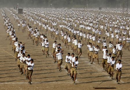 Volunteers of the Hindu nationalist organisation Rashtriya Swayamsevak Sangh (RSS) take part in a drill on the last day of their three-day workers' meeting in Ahmedabad, India, in this January 4, 2015 file photo. REUTERS/Amit Dave/Files
