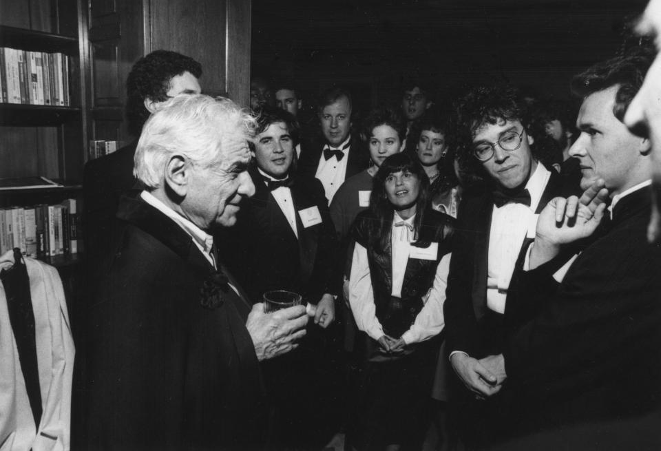 Leonard Bernstein talks to students in October 1988 at a post-concert reception held at the home of the University of Michigan s then-president, James Duderstadt.