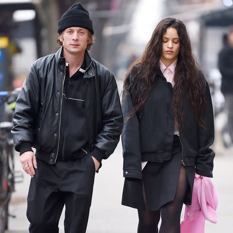 <p>TheImageDirect.com</p> Jeremy Allen White and Rosalía out on a walk in N.Y.C. on Jan. 3, 2024.