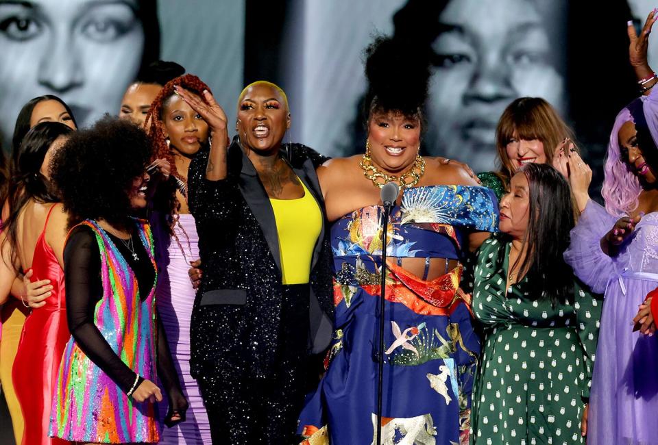 SANTA MONICA, CALIFORNIA - DECEMBER 06: 2022 PEOPLE'S CHOICE AWARDS -- Pictured: Honoree Lizzo accepts The People's Champion award on stage during the 2022 People's Choice Awards held at the Barker Hangar on December 6, 2022 in Santa Monica, California. --  (Photo by Rich Polk/E! Entertainment/NBC via Getty Images)