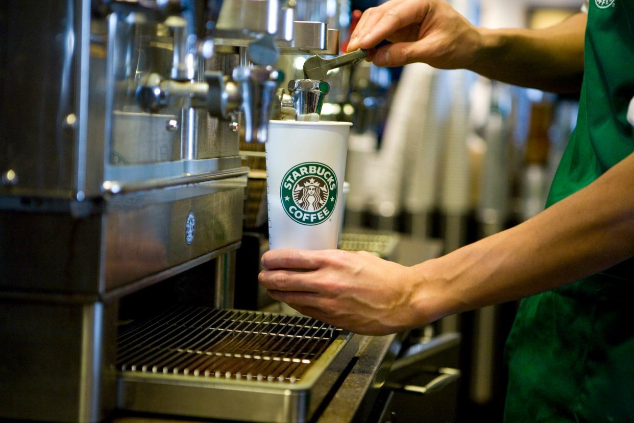 A Starbucks barista prepares a drink at a Starbucks Coffee Shop location in New York.