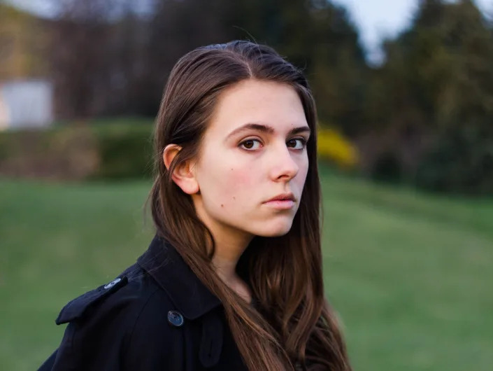 Oleksandra "Sasha" Kuvshynova looks at camera in a three-quarter profile portrait.