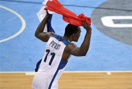 France's Florent Pietrus reacts after winning their European championship basketball final against Lithuania in Ljubljana's Arena Stozice September 22, 2013. REUTERS/Srdjan Zivulovic