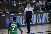 iBoston Celtics head coach Brad Stevens looks toward Jaylen Brown (7) during the first half of an NBA basketball game against the Milwaukee Bucks Friday, July 31, 2020, in Lake Buena Vista, Fla. (AP Photo/Ashley Landis, Pool)