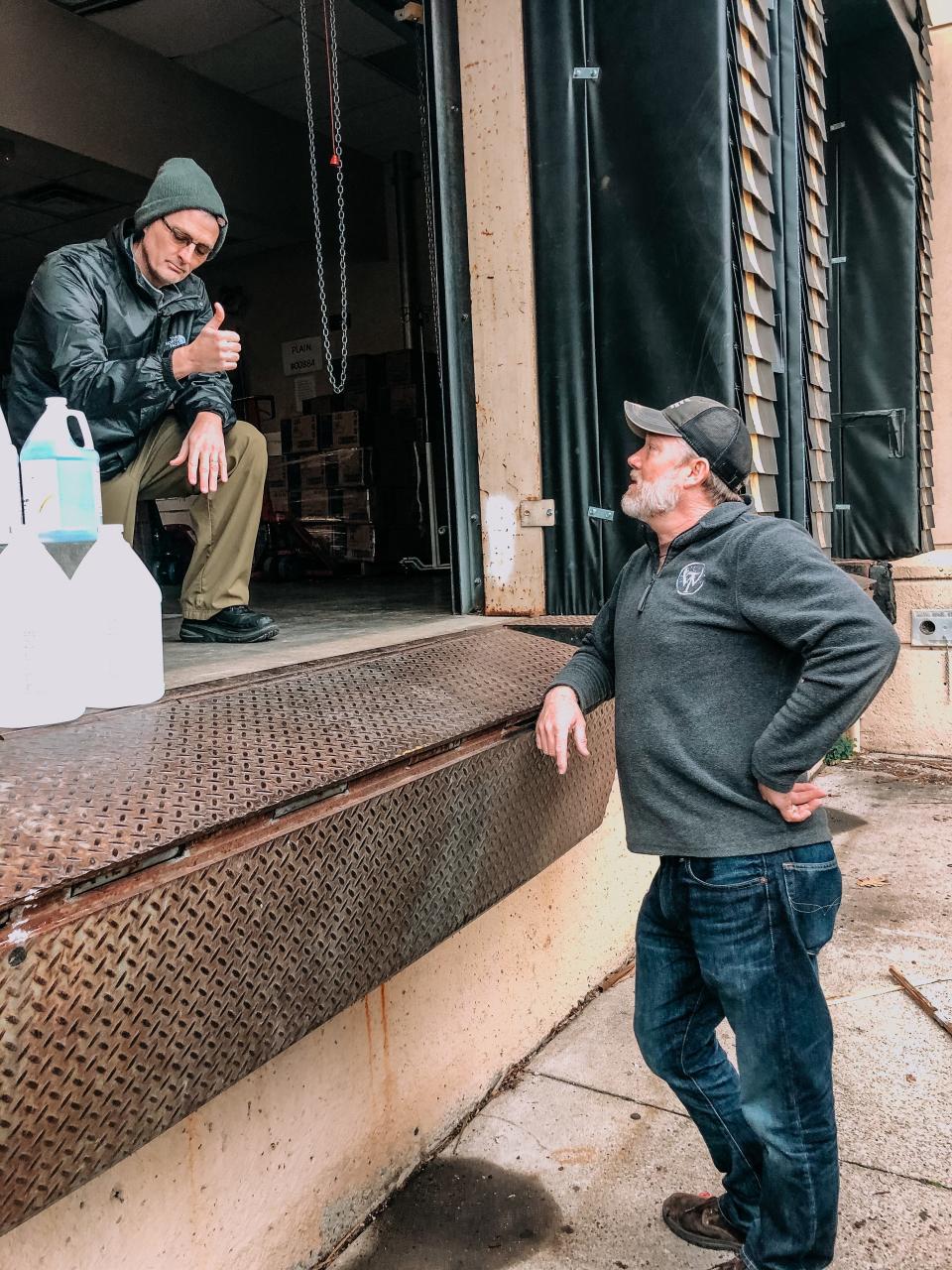 Boyle County Health Department Director Brent Blevins, left, talks to Wilderness Trail Distillery co-owner Shane Baker. Wilderness Trail Distillery plans to make 500 gallons of hand sanitizer a week for health care workers in Danville.