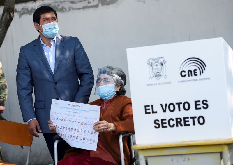 FILE PHOTO: FILE PHOTO: Ecuadorean presidential candidate Arauz stands next to his grandmother