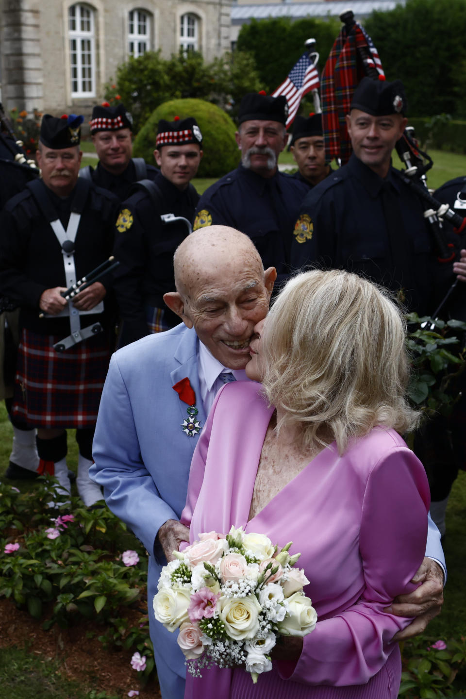 US WWII veteran Harold Terens, 100, left, and Jeanne Swerlin, 96, arrive to celebrate their wedding at the town hall of Carentan-les-Marais, in Normandy, northwestern France, on Saturday, June 8, 2024. Together, the collective age of the bride and groom was nearly 200. But Terens and his sweetheart Jeanne Swerlin proved that love is eternal as they tied the knot Saturday inland of the D-Day beaches in Normandy, France. (AP Photo/Jeremias Gonzalez)