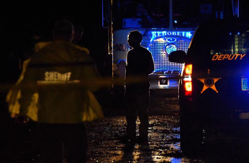 Emergency crews gather at the scene after a storm ripped through a mobile home killing several people in Rehobeth, Ala., Monday, Jan. 2, 2017. (Jay Hare/Dothan Eagle via AP)