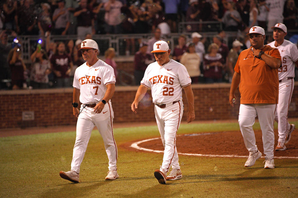 Texas baseball coach David Pierce, right, leaves the field at the College Station Regional after a 4-2 loss to Texas A&M at Blue Bell Park on June 1. Pierce was fired on Monday after eight seasons.