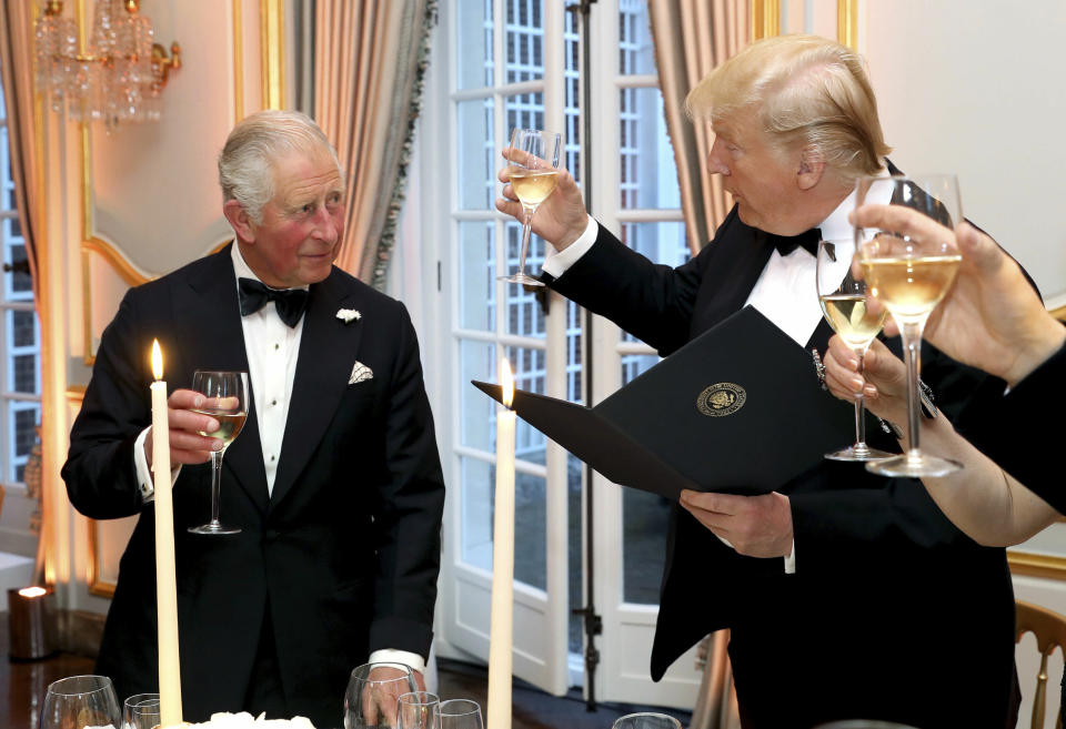 US President Donald Trump and Britain's Prince Charles toast, during the Return Dinner in Winfield House, the residence of the Ambassador of the United States of America to the UK, in Regent's Park, part of the president's state visit to the UK, in London, Tuesday June 4, 2019. (Chris Jackson/Pool Photo via AP)