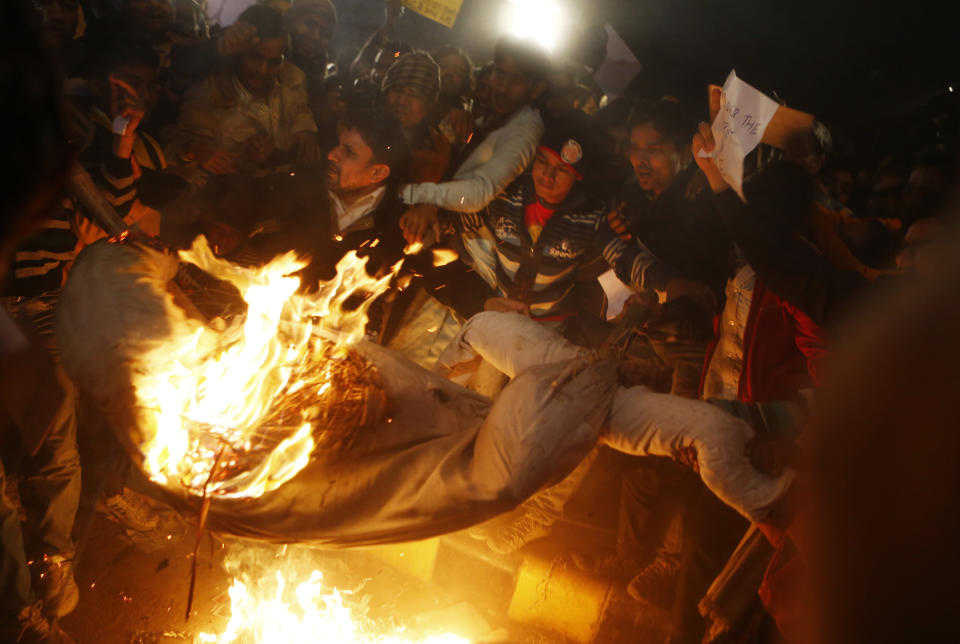 Indian protesters burn an effigy depicting rapists during a rally in New Delhi on December 30, 2012, following the cremation of a gangrape victim in the Indian capital. (Andrew Caballero-Reynolds/AFP/Getty Images)