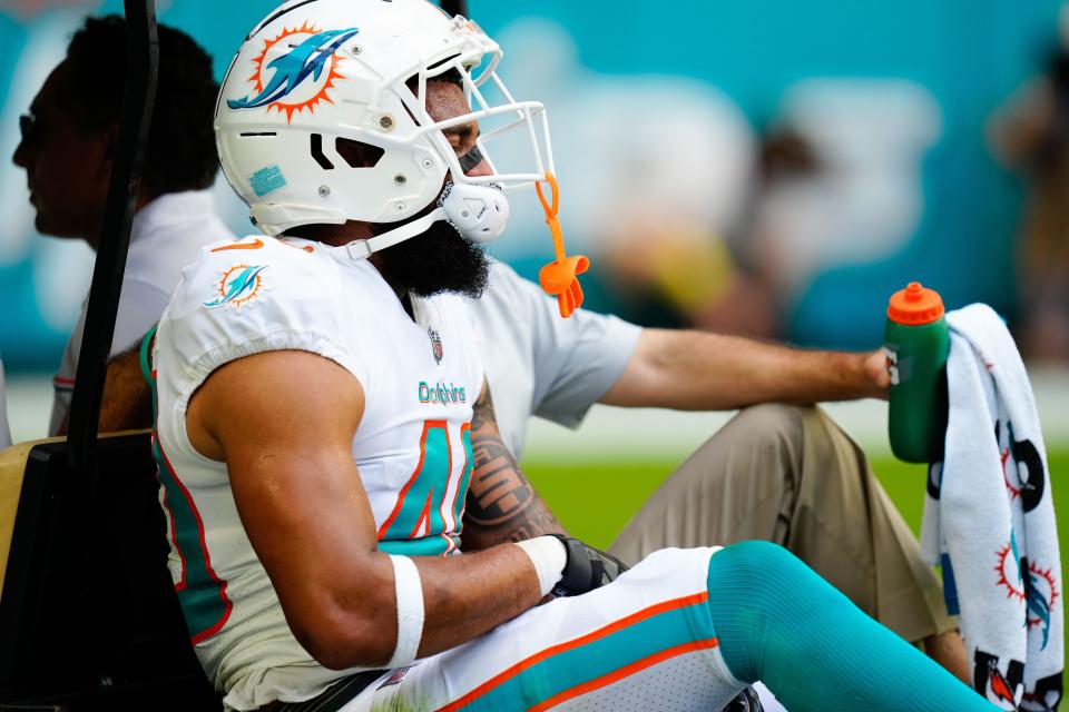 Dolphins cornerback Nik Needham leaves the field on a cart after injuring his ankle during the second quarter of Sunday's loss to the Vikings.