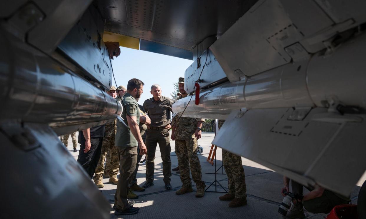 <span>Ukraine’s president, Volodymyr Zelenskiy, examines weapons provided by the west, including Storm Shadow missiles, as he meets members of the Ukrainian air force in August.</span><span>Photograph: Ukrainian Presidential Press Off/UPI/Shutterstock</span>