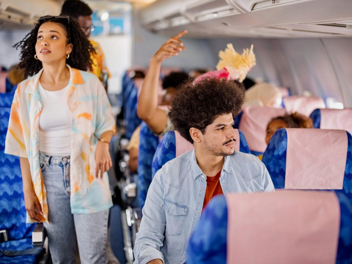 What you should do if a fellow passenger on a plane insists you switch seats, according to travel experts