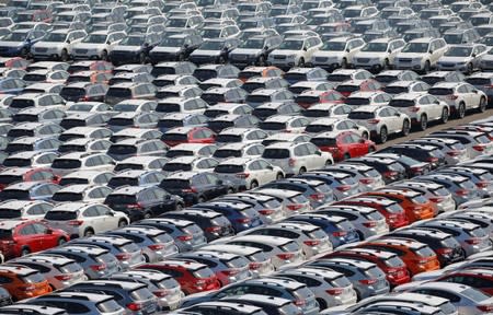 FILE PHOTO: Newly manufactured cars of the automobile maker Subaru await export in a port in Yokohama