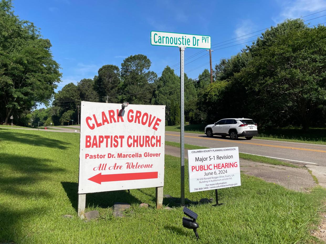 Clark Grove Baptist Church's entrance is marked by a sign advertising the Columbia County public hearing notice that will determine the future for a proposed rebuilt church sanctuary.