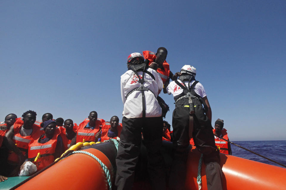 African migrants on a rubber boat in the Mediterranean Sea, off Libya are rescued by the MV Geo Barents vessel of MSF (Doctors Without Borders), in the central Mediterranean route, Monday, Sept. 20, 2021. (AP Photo/Ahmed Hatem)