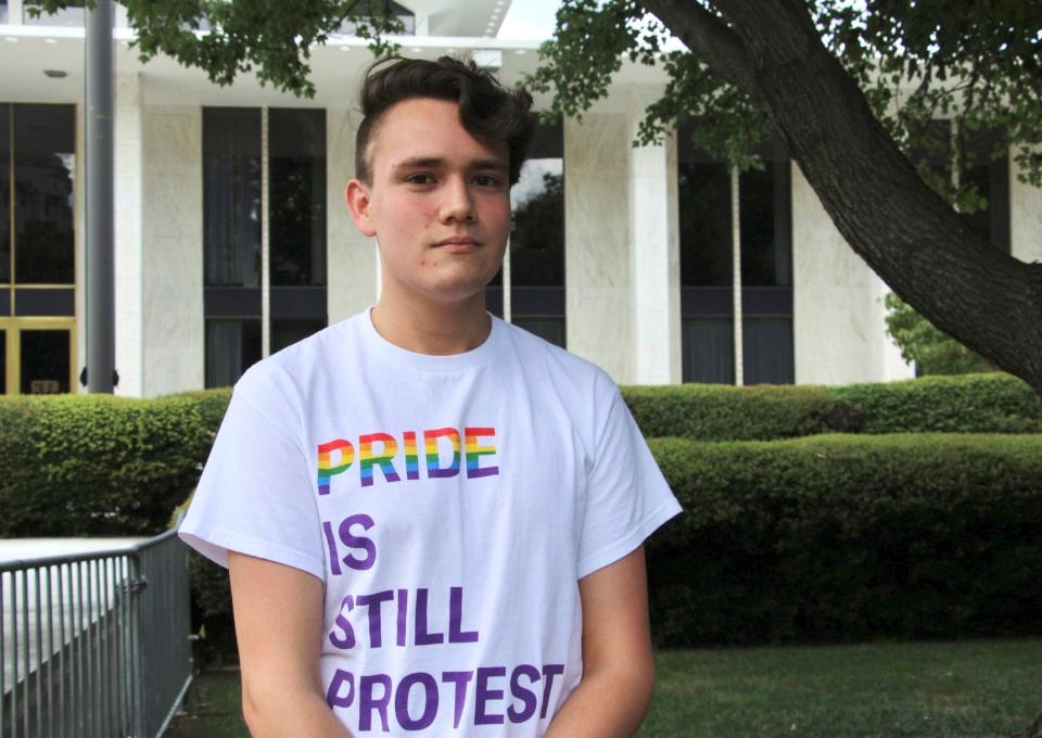 North Carolina State University student and LGBTQ+ rights activist Nathaniel Dibble, 19, poses for a portrait outside the state Legislative Building in Raleigh, N.C., Wednesday, Aug. 16, 2023. Republican state lawmakers will attempt later Wednesday to override the Democratic governor's veto of legislation banning gender-affirming health care for minors.
