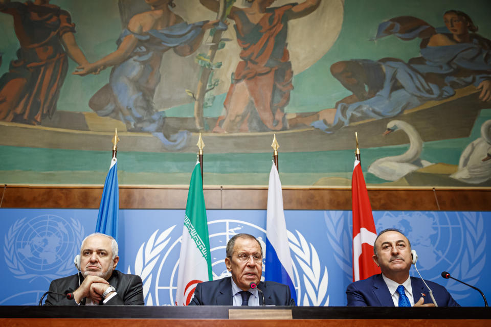 From left to right: Iranian Foreign Minister Mohammad Javad Zarif, Russian Foreign Minister Sergei Lavrov and Turkish Foreign Minister Mevlut Cavusoglu attend a press conference a day prior to the Syrian Constitutional Committee meeting in Geneva, at the European headquarters of the United Nations in Geneva, Switzerland, Tuesday, Oct. 29, 2019. Representatives from the Syrian government, opposition and civil society are to begin meeting in Geneva on Wednesday. (Valentin Flauraud, Keystone via AP)