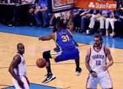 May 28, 2016; Oklahoma City, OK, USA; Golden State Warriors center Festus Ezeli (31) dunks past Oklahoma City Thunder center Steven Adams (12) during the second half in game six of the Western conference finals of the NBA Playoffs at Chesapeake Energy Arena. Mandatory Credit: Kevin Jairaj-USA TODAY Sports