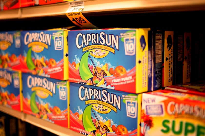 Boxes of Capri Sun juice sit on shelves at a grocery store in San Diego, CA on Tuesday, June 5, 2012. The Walt Disney Company has unveiled plans to limit various unhealthy food products advertised on its child-focused television channels, radio stations and Web sites must comply with a strict new set of nutritional standards.Capri Sun drinks have been named as one of the advertised brands. (Photo by Sandy Huffaker/Corbis via Getty Images)