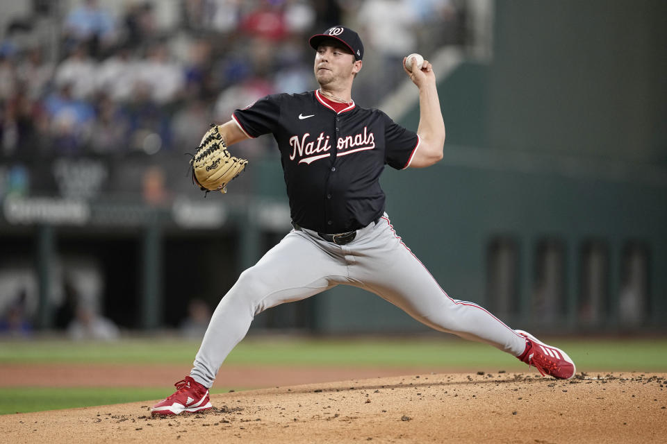 Washington Nationals starting pitcher Mitchell Parker throws to the Texas Rangers in the first inning of a baseball game in Arlington, Texas, Thursday, May 2, 2024. (AP Photo/Tony Gutierrez)