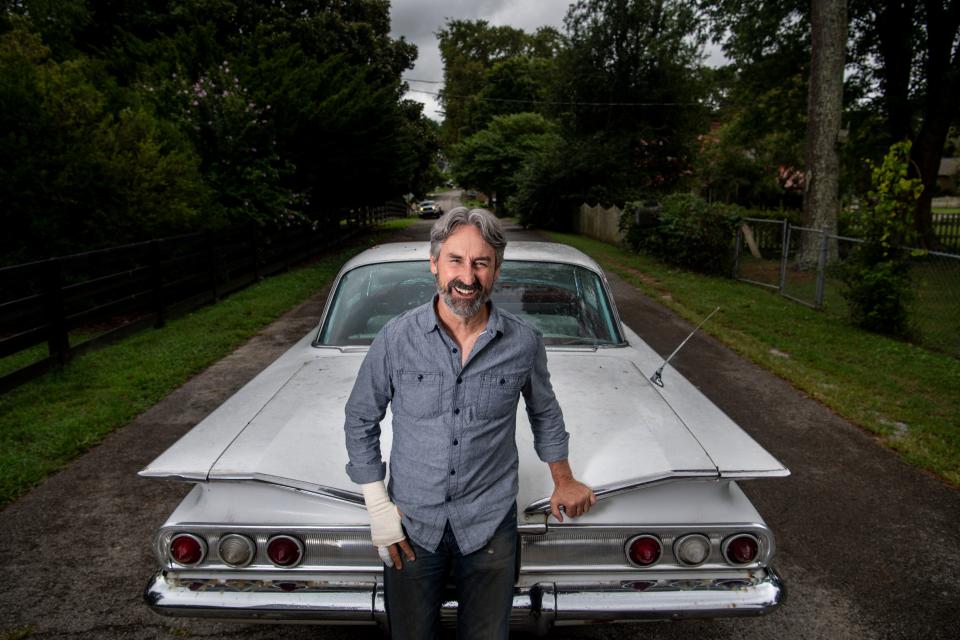 Mike Wolf, the host of TV's "American Pickers," is pictured with a 1960 Impala at his home in Leipers Fork, Tenn., on Friday, Aug. 20, 2021.