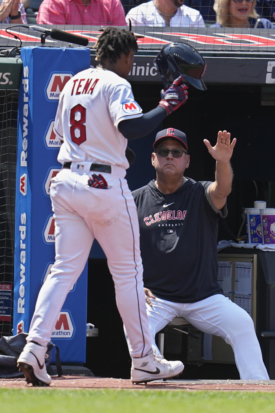 Cleveland Guardians manager Terry Francona, right, greets Jose Tena (8) after Tena scored in the fifth inning of a baseball game against the Toronto Blue Jays, Thursday, Aug. 10, 2023, in Cleveland. (AP Photo/Sue Ogrocki)