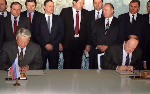 The signing of the Belavezha Accords - Credit: 2011 AFP/DAVID BRAUCHLI