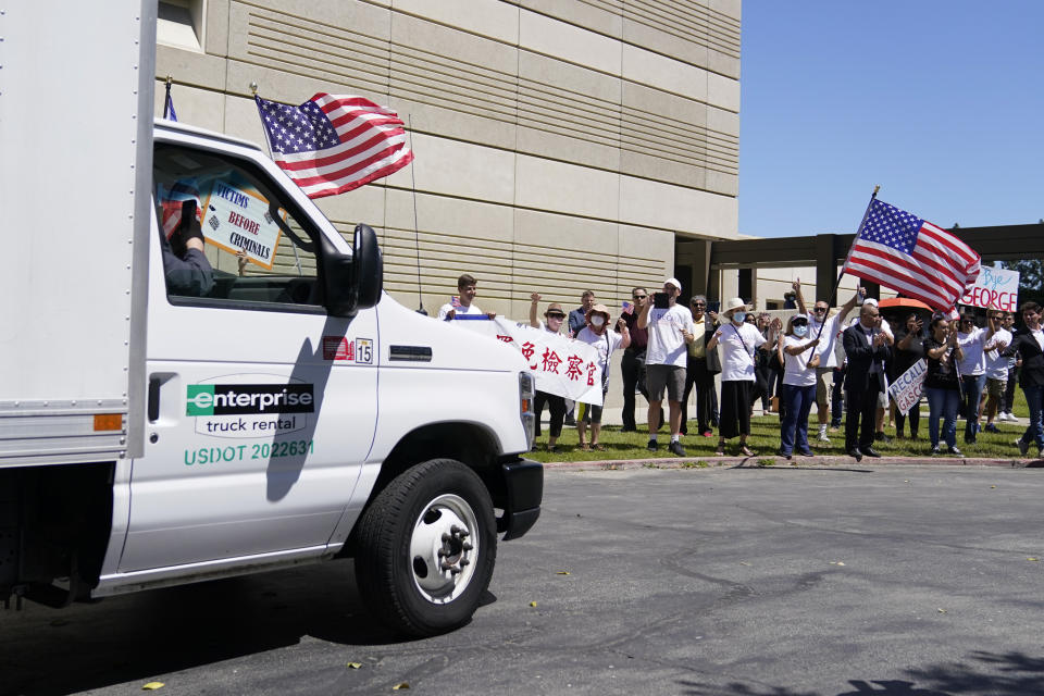 Supporters of a campaign to recall Los Angeles County District Attorney George Gascon gather to view a truck full of petitions outside the Los Angeles County Registrar of Voters on Wednesday, July 6, 2022, in Norwalk, Calif. (AP Photo/Ashley Landis)